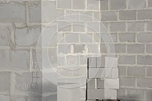 New house construction, building foundation walls using concrete blocks, copy space.