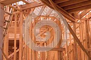 New house construction with wooden beams the ceiling and wall