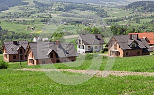 A new housing estate under construction. A housing estate for new homes in the periphery. mountainous terrain, Building home photo