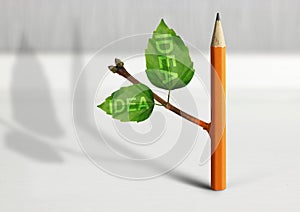 New idea creative concept, pencil with leaves on table