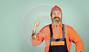 new idea. man wear boilersuit. bearded worker in overalls. Confident Mature Mechanic. Portrait Of Repairman. Worker in