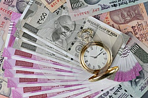 New Indian Rupees Currency with antique time watch photo