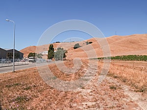 New industrial land in summer drought colours subdivided and roaded awaiting development of new buildings photo
