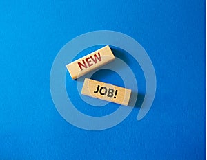 New job symbol. Wooden blocks with words New job. Beautiful blue background. Business and New job concept. Copy space