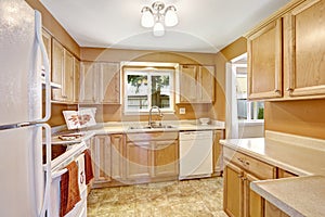New kitchen cabinets with white appliances