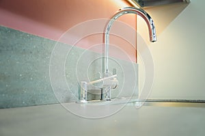 A new kitchen sink with an artificial stone countertop. The concept of modern kitchen interior