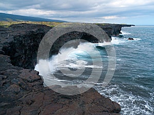 New land created by lava flows pounded by the Pacific Ocean waves photo