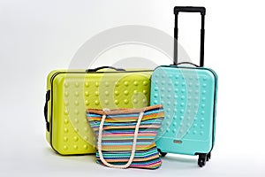 New large suitcases, textile handbag.