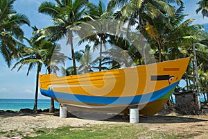 New large unfinished boat on the beach.