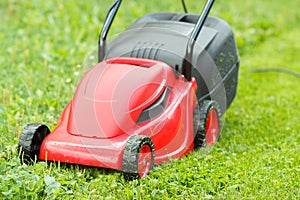 New lawnmower on green grass