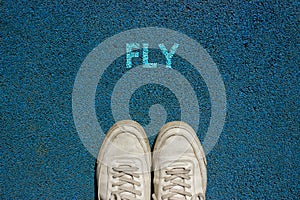 New Life Concept, Motivational Slogan with Word FLY on the Ground of Walk Way