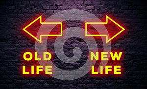 New Life and Old Life Direction Concept With neon Light arrow sign in dark brick wall background. Old and New Life Directions