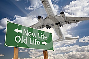 New Life, Old Life Green Road Sign and Airplane Above