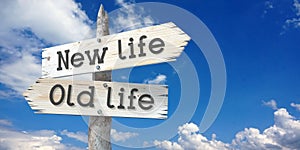 New life, old life - wooden signpost with two arrows