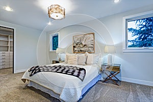 New luxury custom built home with white master bedroom.