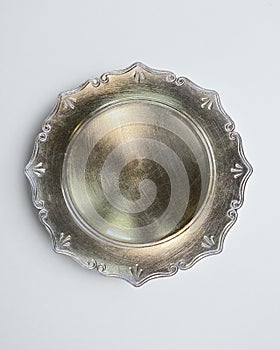 New luxury cutlery view from above on a isolated white background. Top view. Golden saucer. Trendy Indian style plate