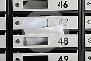 New mailboxes with keyholes, numbers and receipts as background