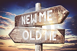 New me, old me - wooden signpost, roadsign with two arrows