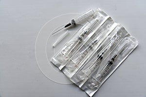 New medical syringes in a package on a white background