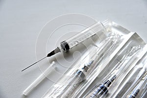 New medical syringes in a package on a white background