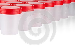 New medical test containers are lined up, isolated on a white background with room for text.