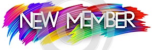 New member paper word sign with colorful spectrum paint brush strokes over white