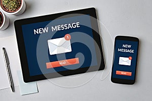 New message notification concept on tablet and smartphone screen