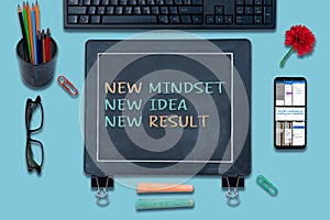 New mindset new results concepts with text on Blackboard. positive thinking and motivation of business