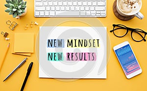 New mindset new results concepts with text on notepad on desk. positive thinking