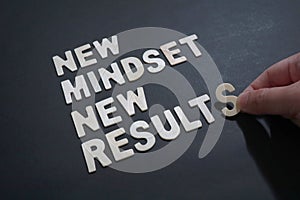 New mindset new results, text words typography written on wooden, self development, life and business motivational inspirational