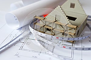 New model house on architecture blueprint plan at desk