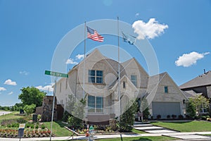New model single-family house with American flag near Dallas, Texas