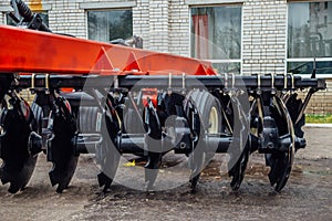 New modern agricultural disc harrow. Tillage equipment photo