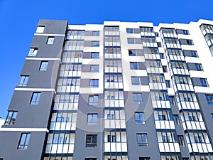 New modern apartment building against blue sky