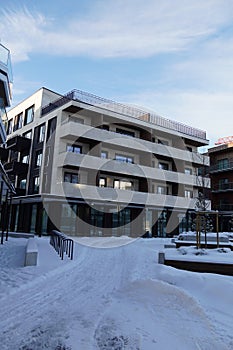 New modern apartments building at Kalamaja district during winter snowy sunny day. Tallinn, Estonia, Europe. January