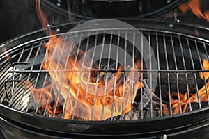 New modern barbecue grill with burning firewood,