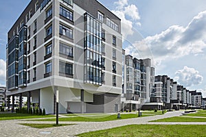 New modern block of flats in green area. residential apartment with flat buildings exterior. luxury house complex. Part of City