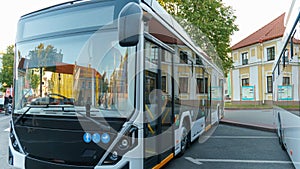 A new modern bus. Modern public electric transport. Details of the bus in close-up, headlights, windshield, driver\'s cabin