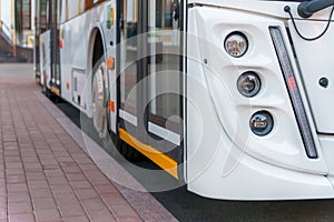 A new modern bus. Modern public electric transport. Details of the bus in close-up, headlights, windshield, driver\'s cabin