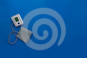 new modern digital tonometer silated, top view with copy space on color background