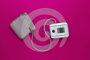 new modern digital tonometer silated, top view with copy space on color background