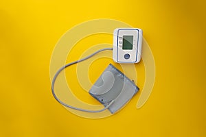 new modern digital tonometer silated, top view with copy space on color background