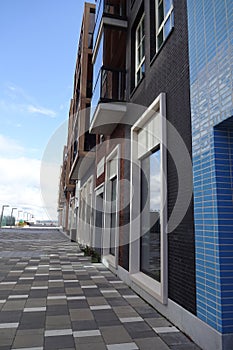 New modern district Noblessner in Tallinn, Estonia, Europe. Colourful facade with balconies of apartment buildings. Blue