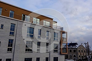 New modern grey apartment building in Noblessner district. Sky with clouds. Winter season. Tallinn, Estonia, Europe