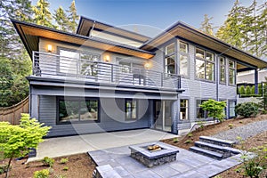 New modern home features a backyard with patio