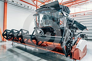 New modern industrial agriculture combine harvester in large garage