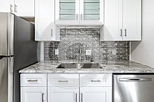 New modern kitchen in an apartment with stainless steel appliances