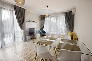 New modern living room with dining room. New home. Interior photography. Wooden floor