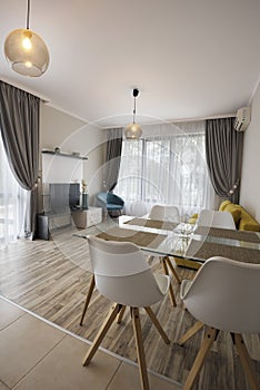 New modern living room with dining room. New home. Interior photography. Wooden floor