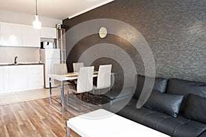 New modern living room with dining room. New home. Interior photography. Wooden floor